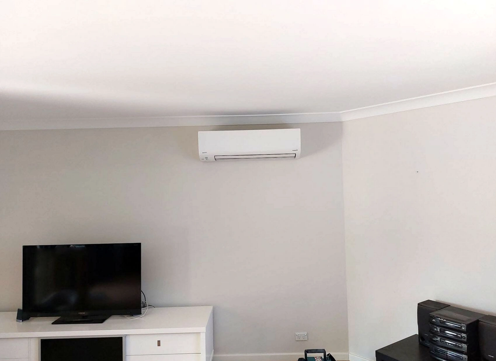 HVAC technician conducting routine maintenance on a heating and cooling system